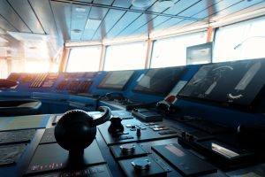 Orlaco image by Seatronx Modern ship bridge wheelhouse control console with multiple navigation displays, helm wheel, and chart-display monitors - real photograph illustrating a marine touchscreen helm environment.