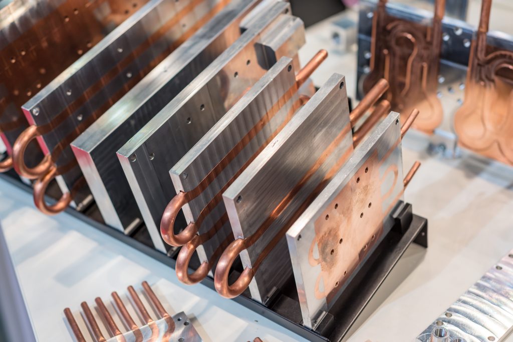 Silicone Rubber Keyboard With Trackball image by Seatronx Aluminum and copper heat sink plates representative of the conduction-cooling hardware specified inside a sealed fanless marine display