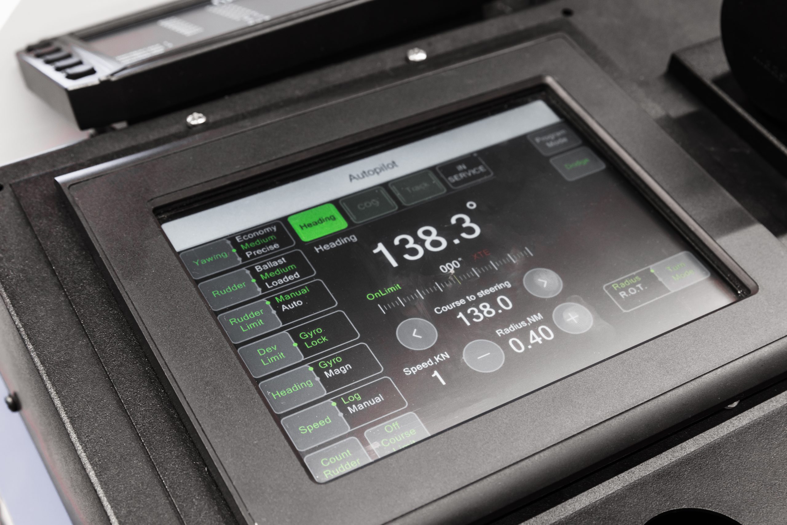 Closeup of a marine touchscreen digitizer surface on a ship bridge navigation console, illustrating the procurement decision moment for a marine-grade sensor stack.