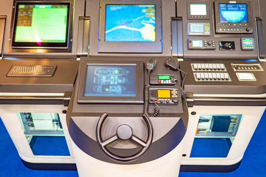 Vehicle And Heavy Equipment image by Seatronx Vessel bridge console with separate sonar, electronic chart and vessel monitoring displays mounted above the helm